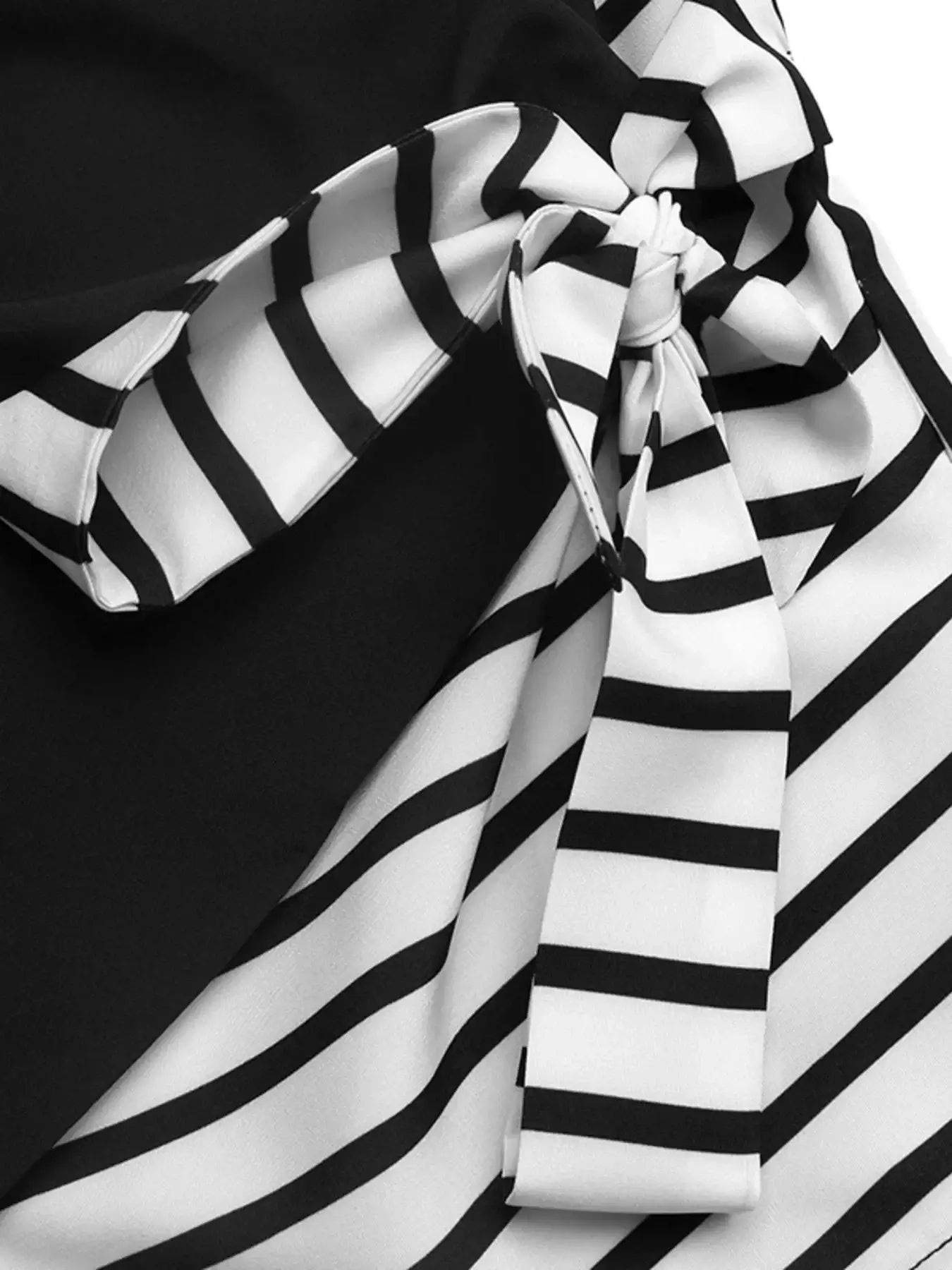 Striped Color Block Surplice Shirt featuring black and white striped fabric with a stylish knot detail.