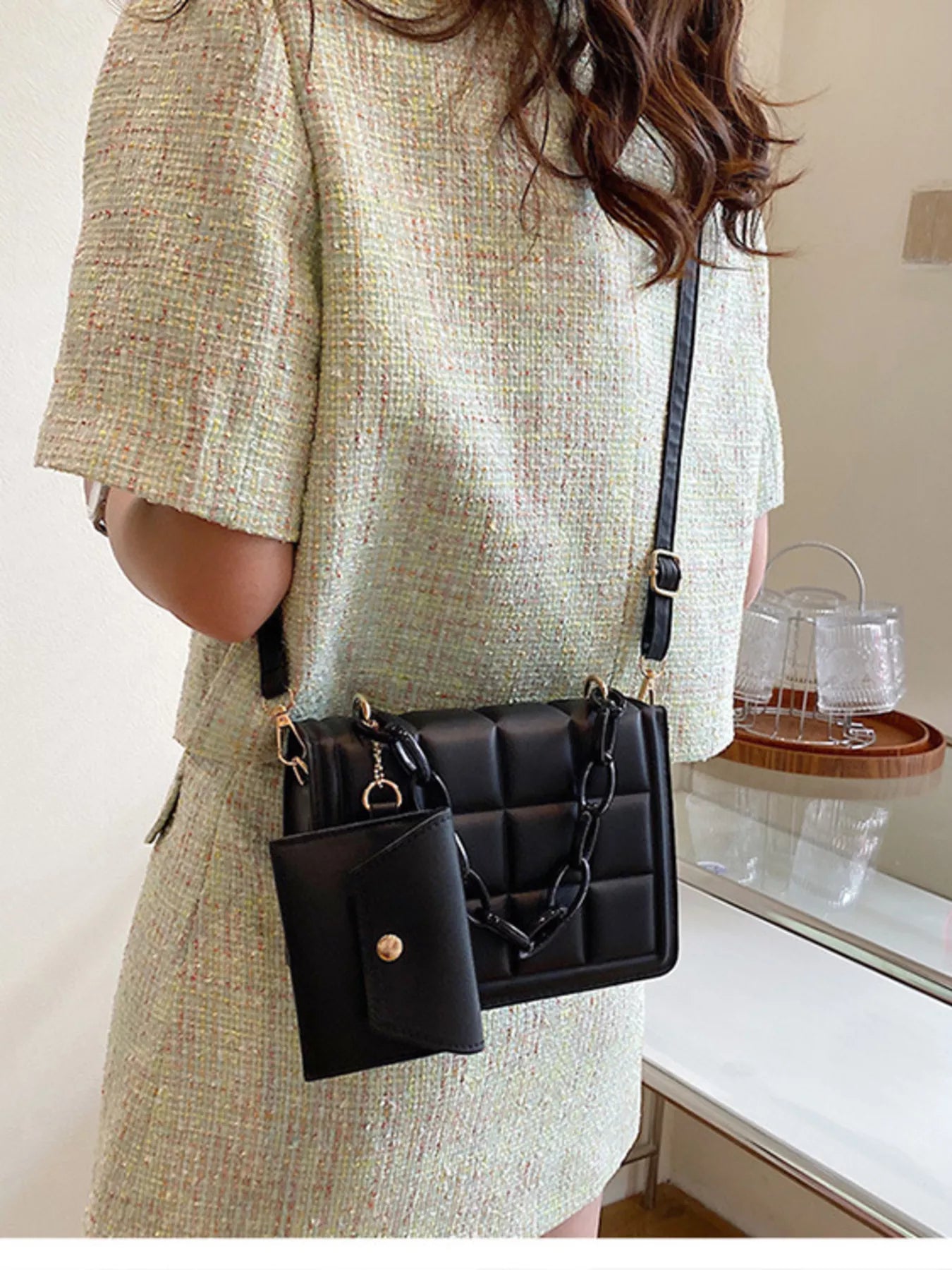 Quilted Chain Strap Crossbody Bag worn by a woman, featuring a mini PU leather chain purse with a sleek design.