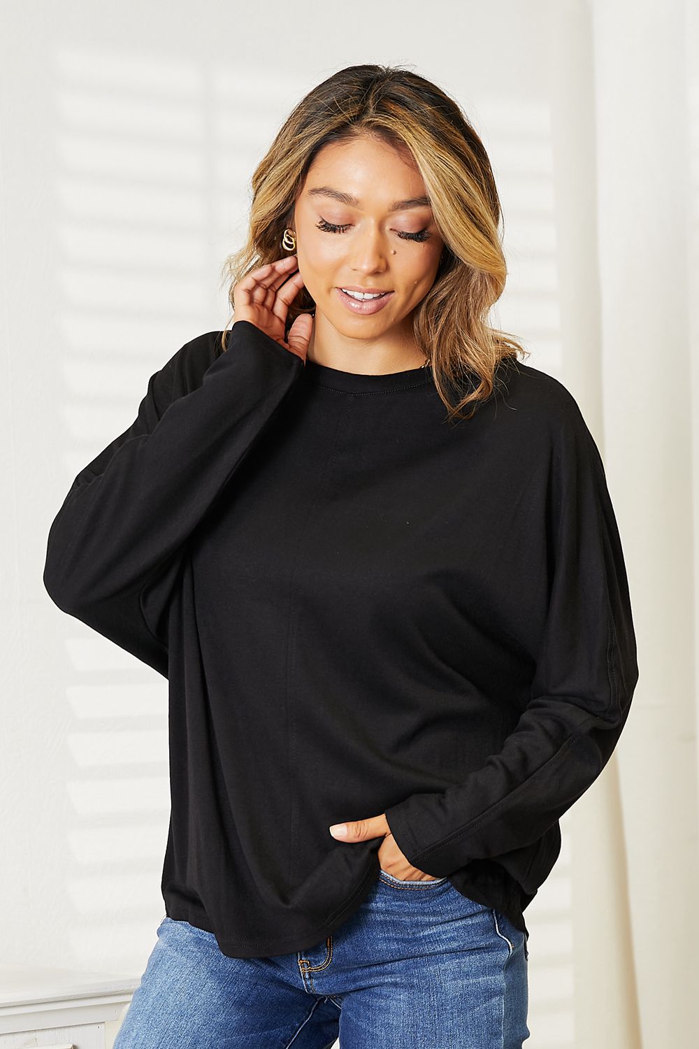 Double Take Seam Detail Round Neck Long Sleeve Top for Women in black, showcasing its casual style and comfort.