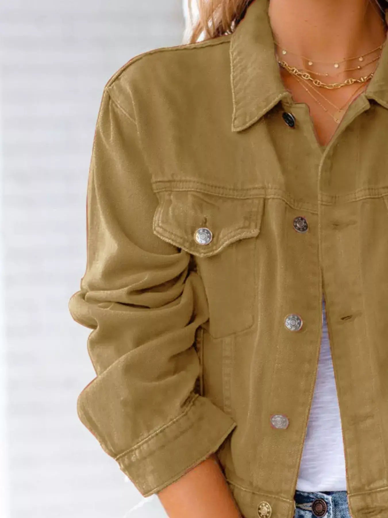 Women's button-up long sleeve denim jacket in olive green, perfect for layering and casual outfits.