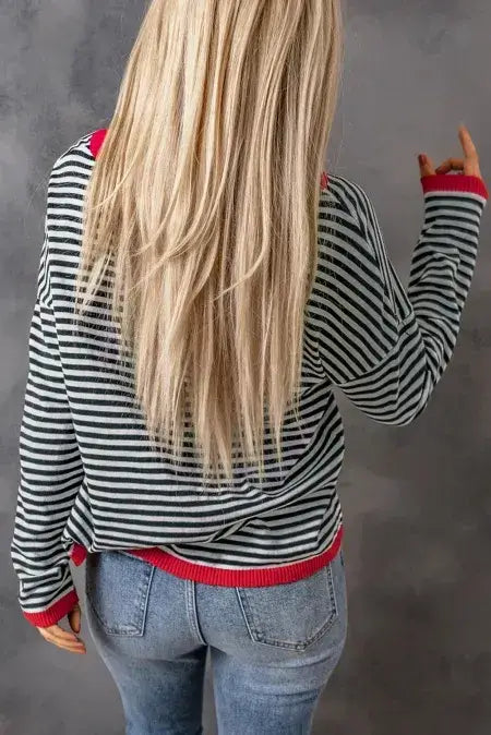 Striped Round Neck Drop Shoulder T-Shirt worn from the back, featuring classic stripes and drop shoulder design.