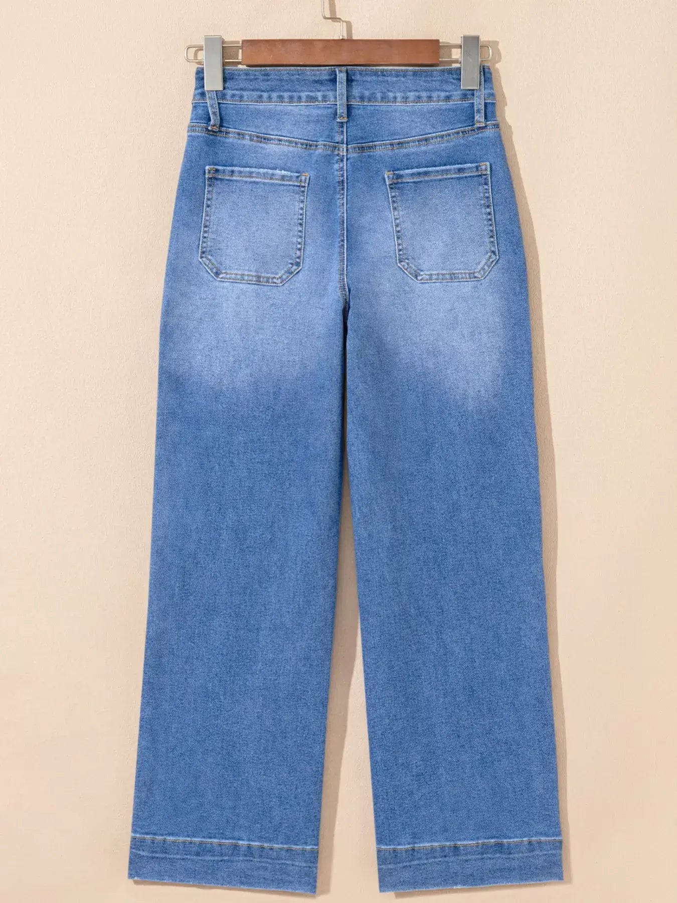 Back view of High-Waisted Wide Leg Flare Jeans showcasing the wide leg cut and denim texture.