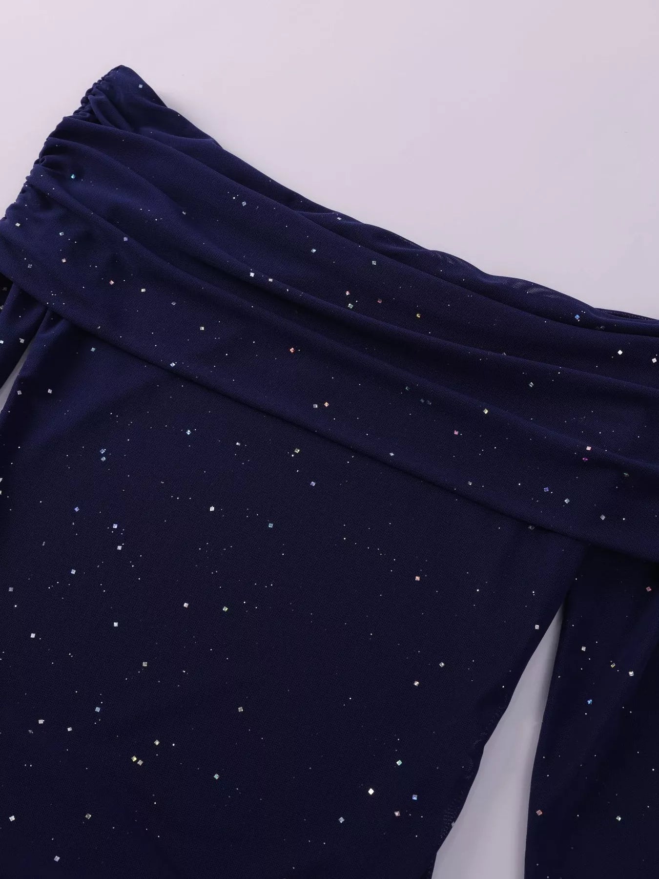 Top view of the Glitter Off-Shoulder Maxi Dress showcasing its glittery fabric and elegant design.