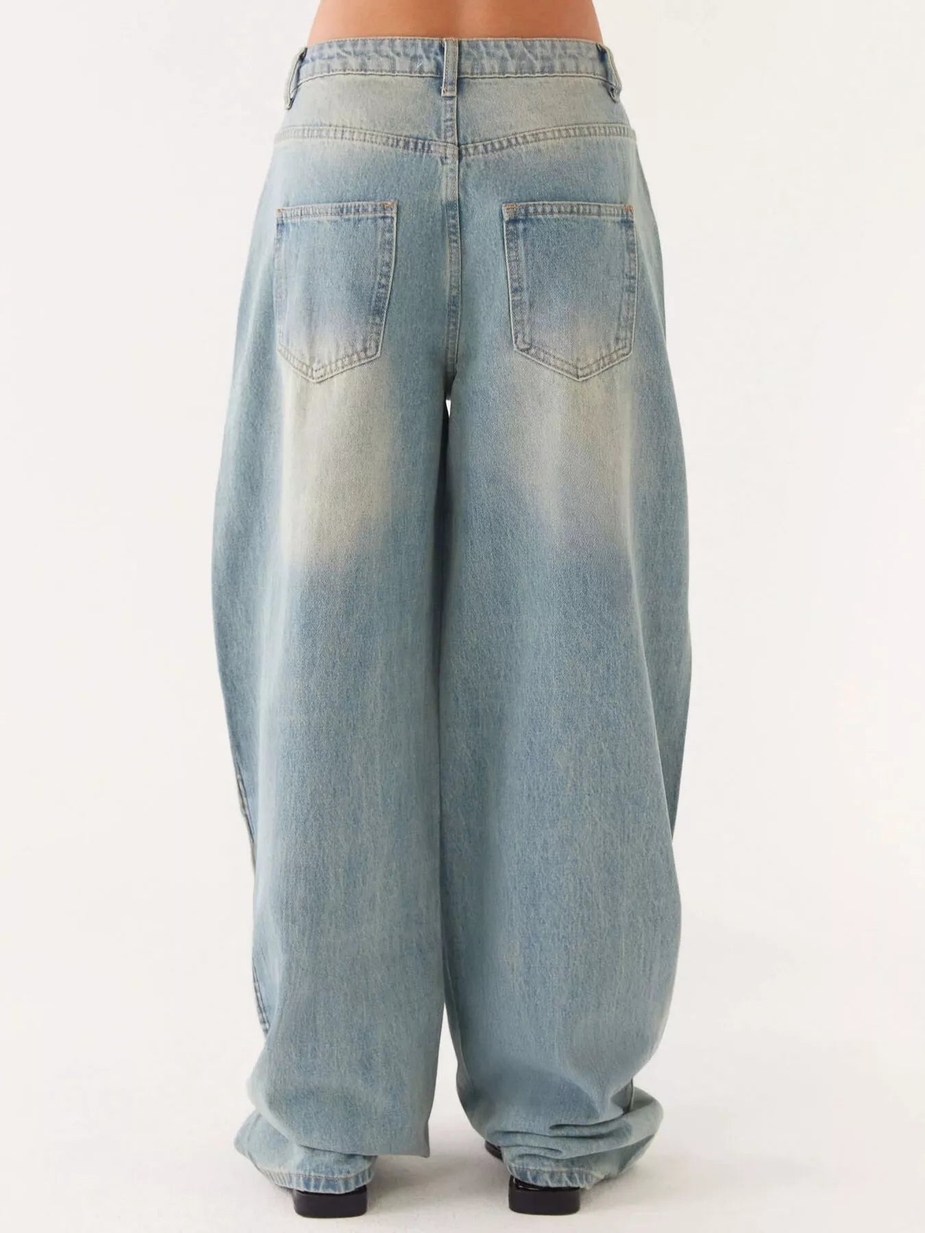 Back view of Button Up Denim Jacket and Jeans Set showcasing loose fit jeans in light wash denim.