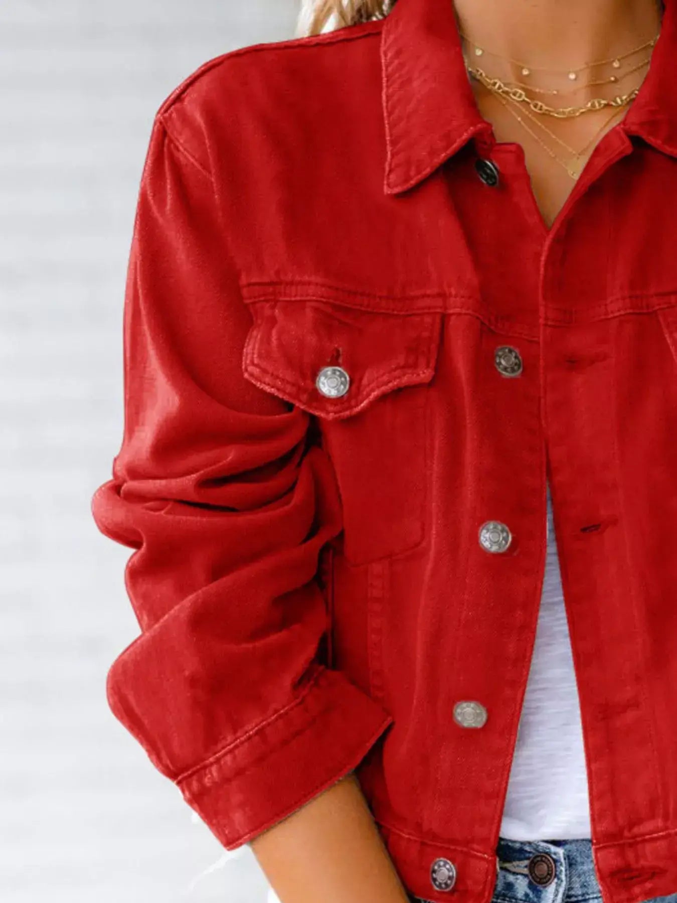 Stylish red button-up long sleeve denim jacket for women, perfect for layering and casual outfits.