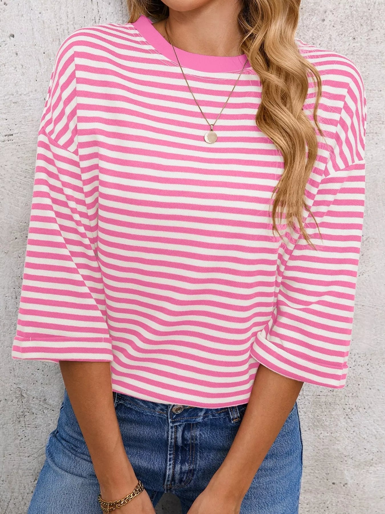 Striped Back Bow Tie T-Shirt in pink and white stripes, featuring oversized sleeves and casual style.