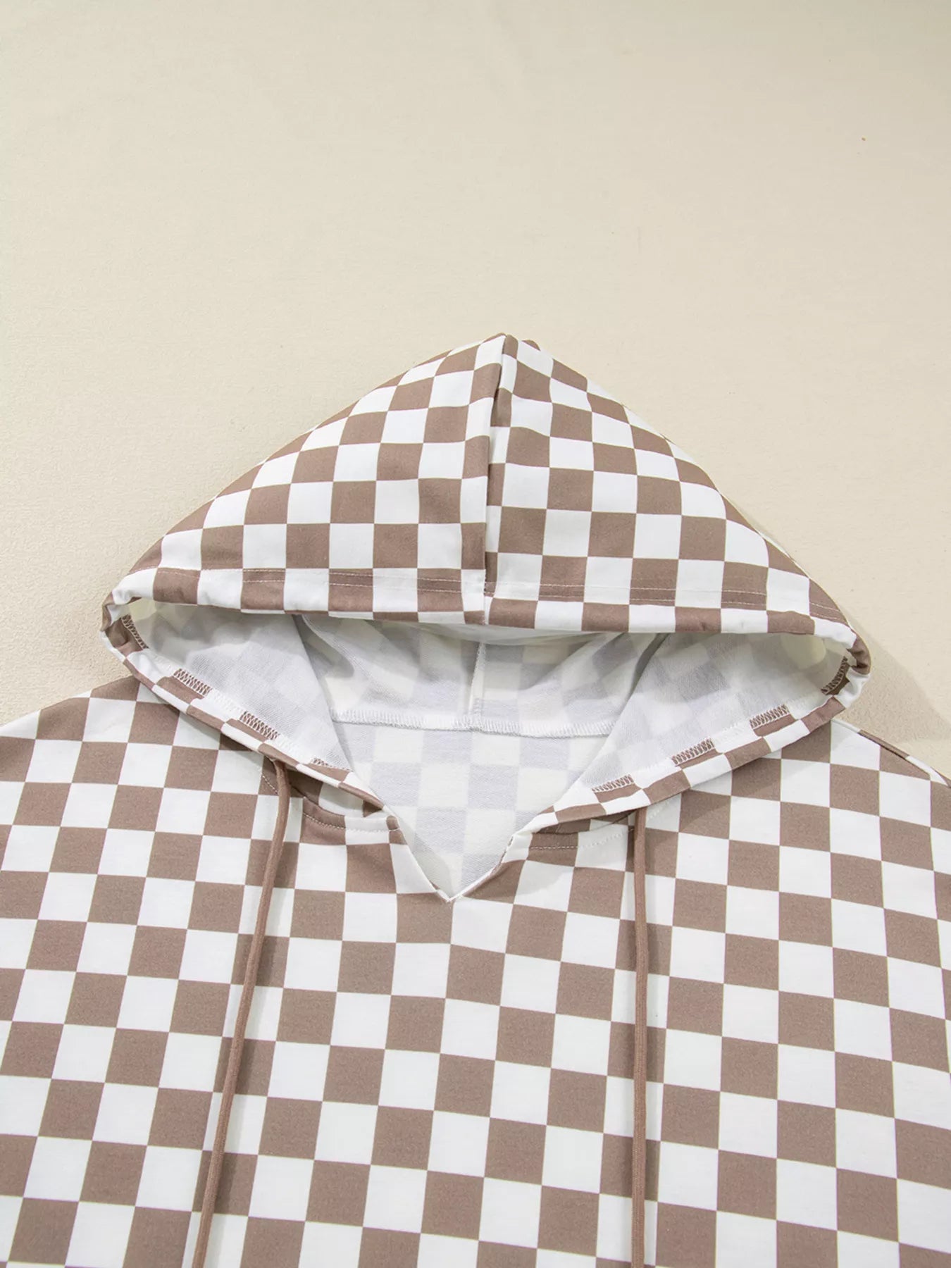 Checkered Pattern Oversized Drawstring Hoodie with a hood in brown and white checkered design.