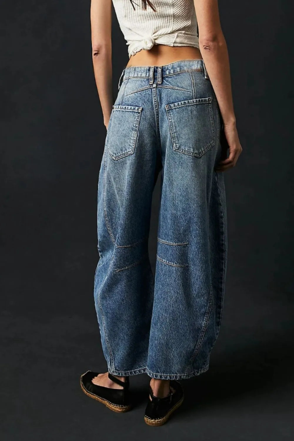 Wide Leg Jeans with Pockets viewed from the back, featuring a relaxed fit and stylish pockets for everyday casual look.