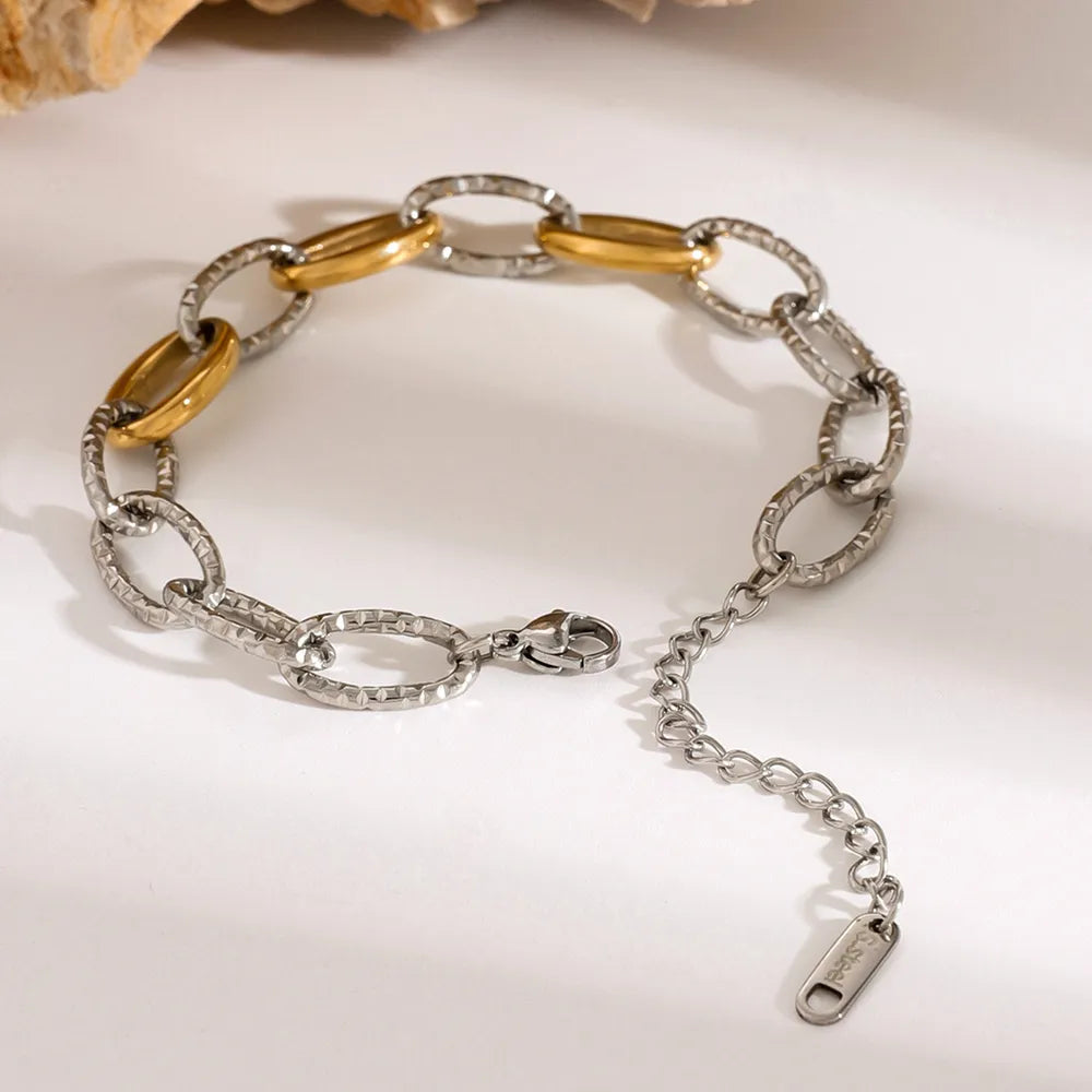 18K Gold-Plated Stainless Steel Bracelet showcasing a stylish design with gold and silver links.