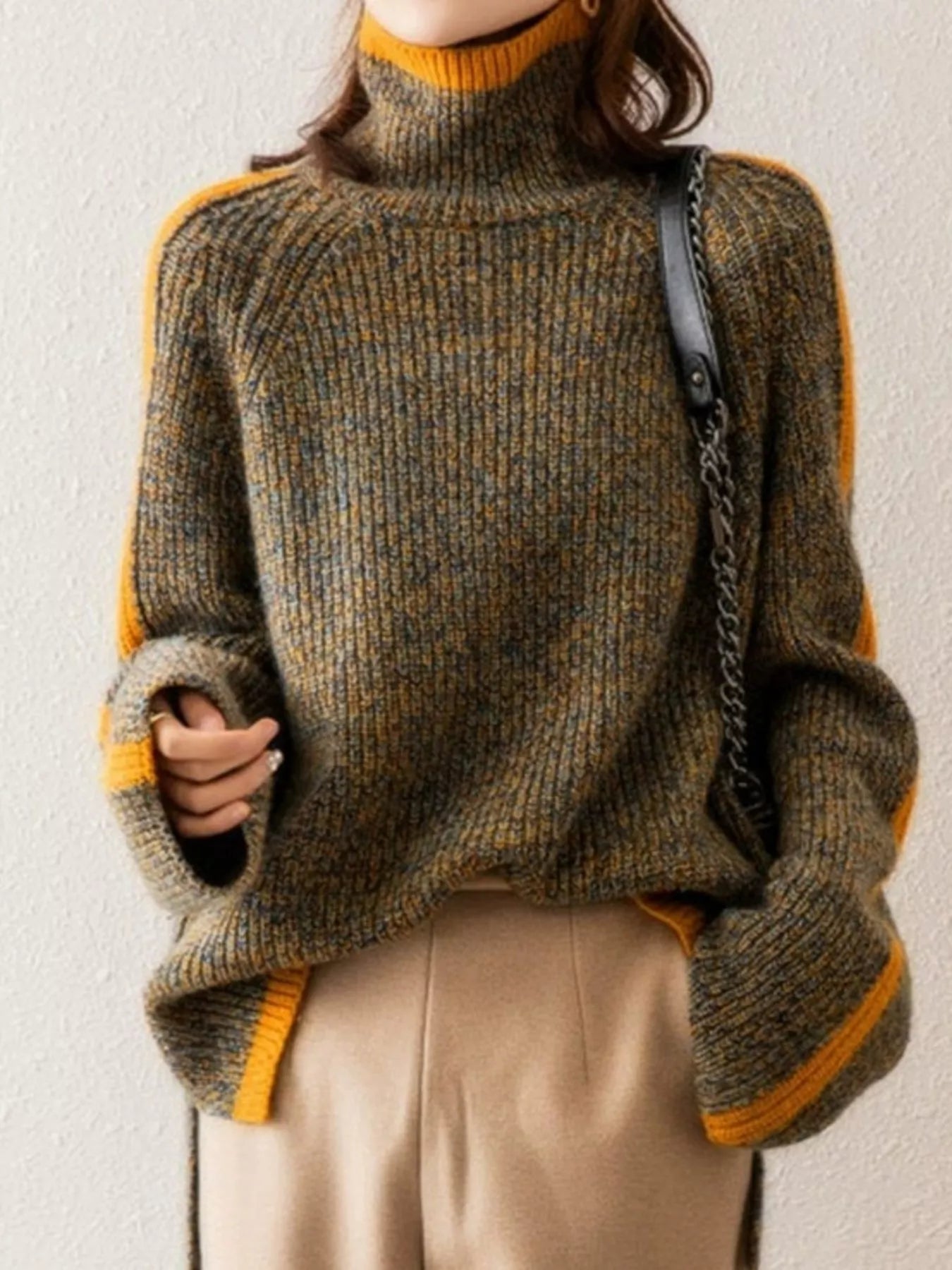 Contrast Trim Turtleneck Long Sleeve Sweater in ribbed design with contrasting yellow trim, worn with beige pants.