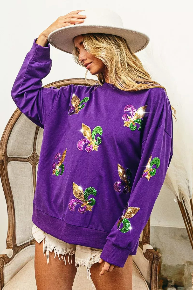 BiBi Fleur De Lis Sequin Patches Mardi Gras Sweatshirt in purple with sequin designs, perfect for festive celebrations.