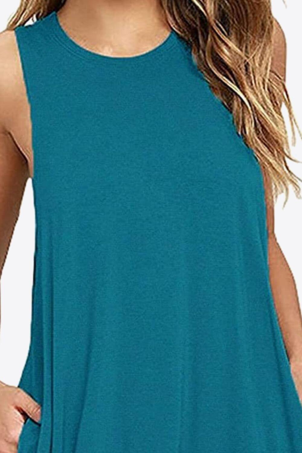 Full size sleeveless round neck dress in teal with side pockets for casual wear.