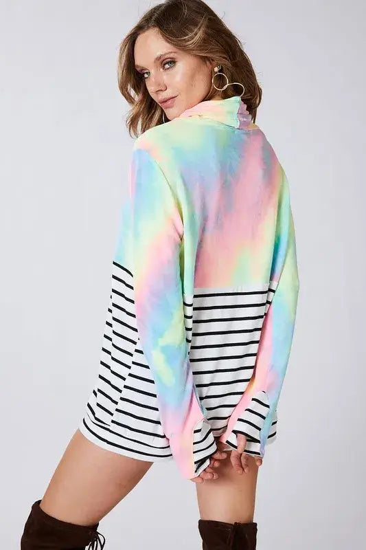 Model wearing BiBi Tie Dye French Terry Cowl Neck Top in vibrant colors with black and white stripes.