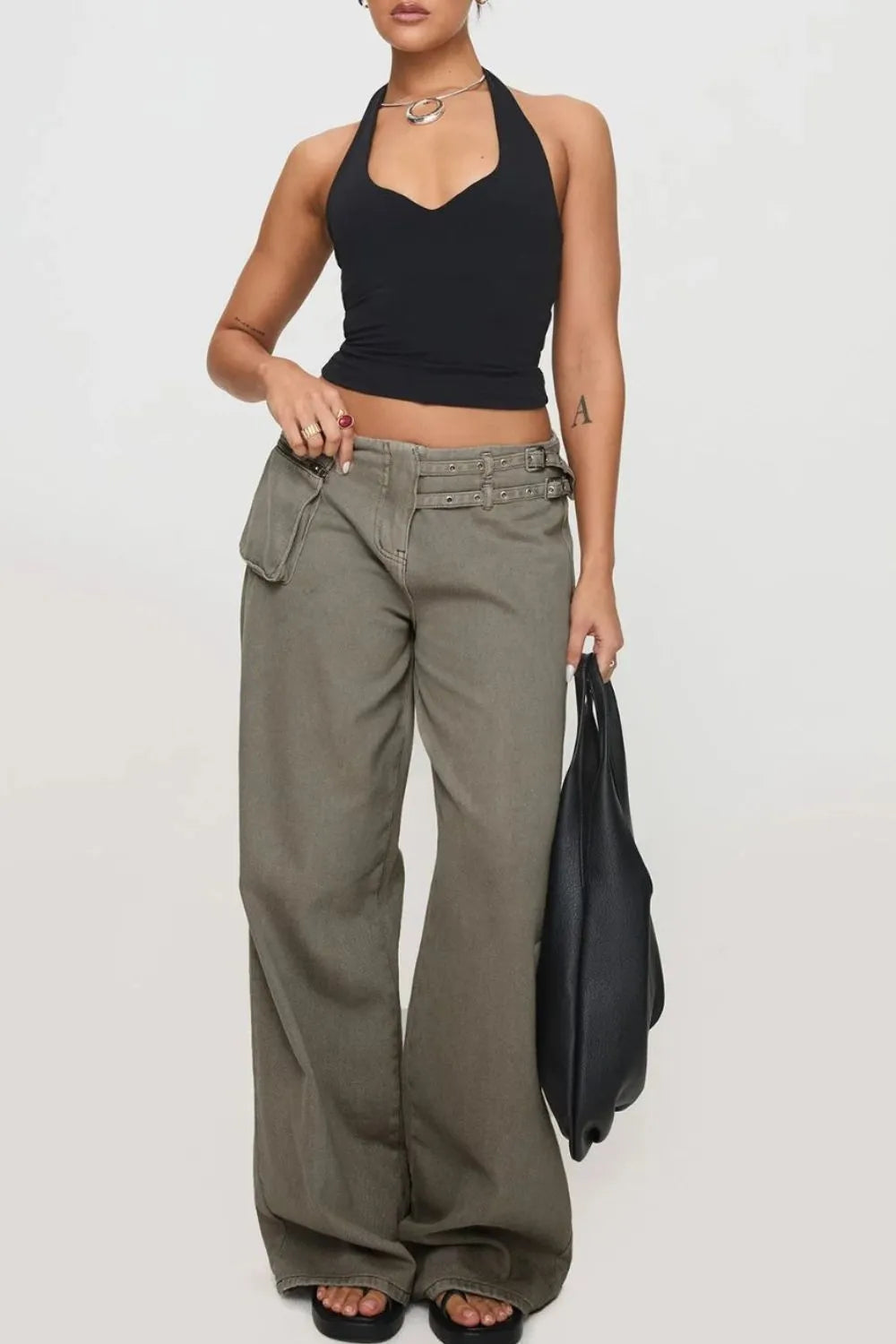 Wide Leg Jeans with Pockets for comfortable everyday wear, paired with a black cropped top and accessorized.