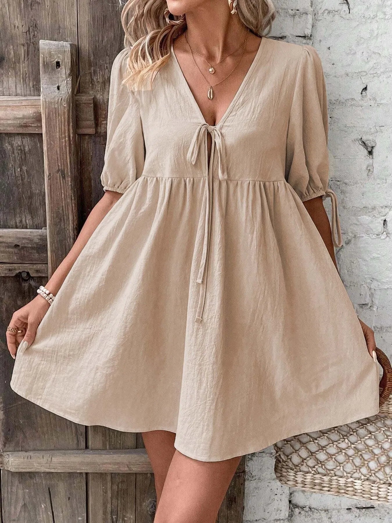 V-Neck Tie-Front Mini Dress with Puff Sleeves in beige, elegant and casual style, suitable for warm weather.
