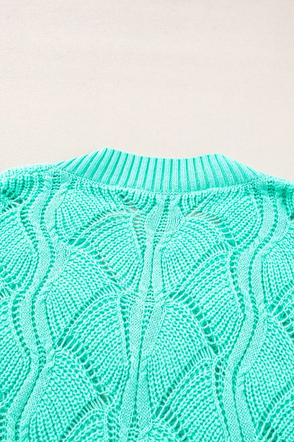 Elegant Texture V-Neck Knit Top featuring a cable-knit design in mint green, showcasing openwork detail and ribbed neckline.