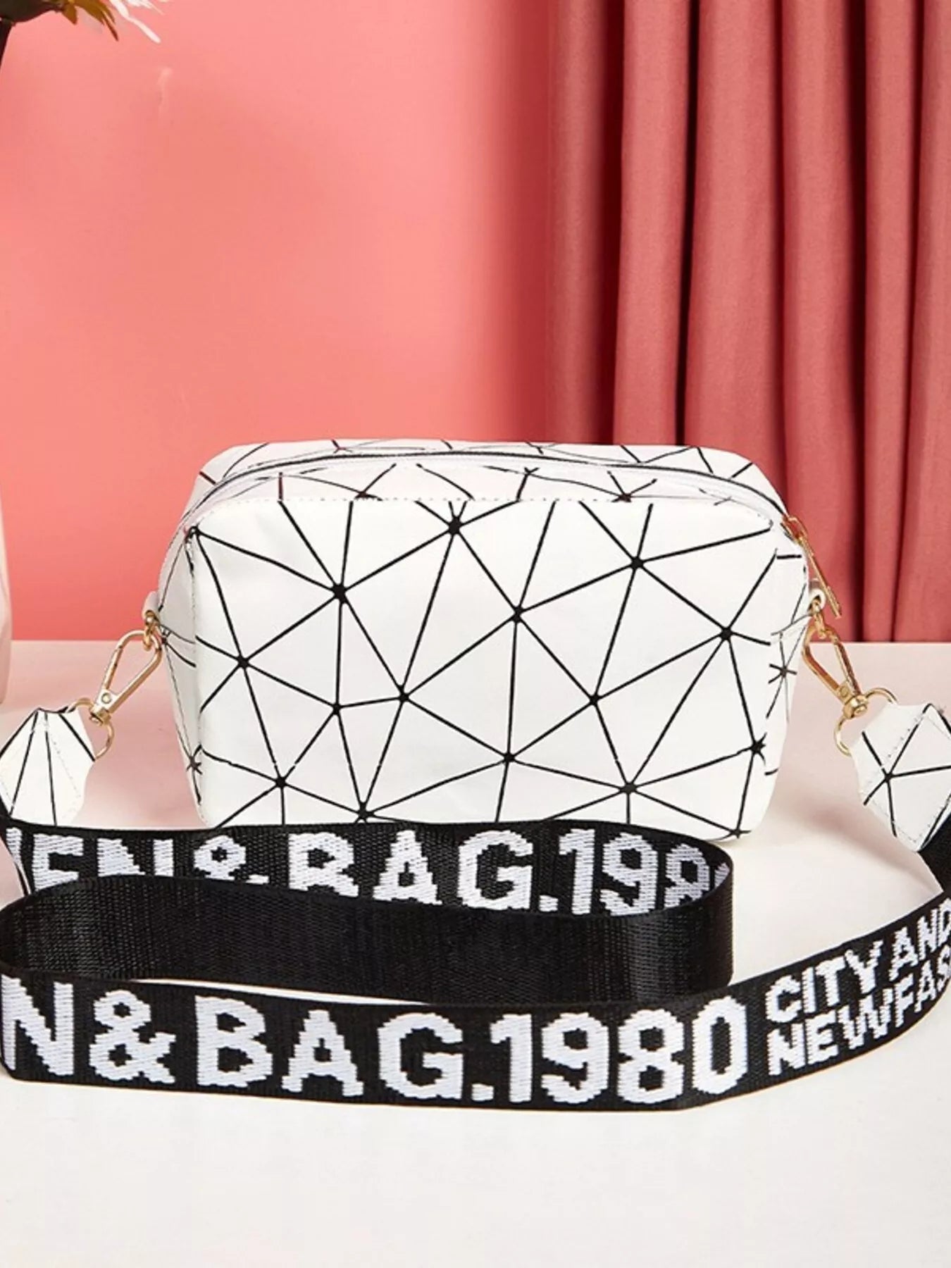 Geometric Pattern Crossbody Bag featuring a modern design in white with black geometric lines and a stylish strap.