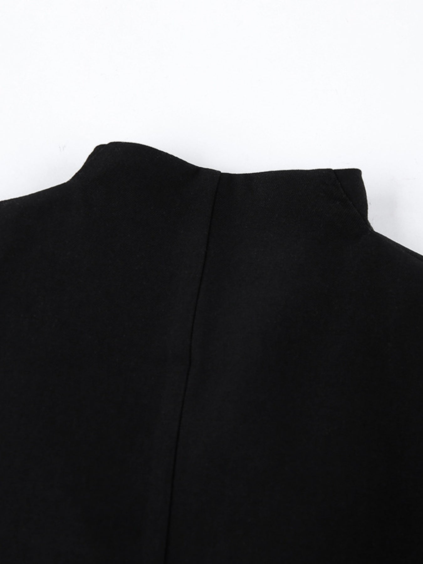 Back detail of the Pleated One Button Blazer Dress showcasing its elegant tailored design.