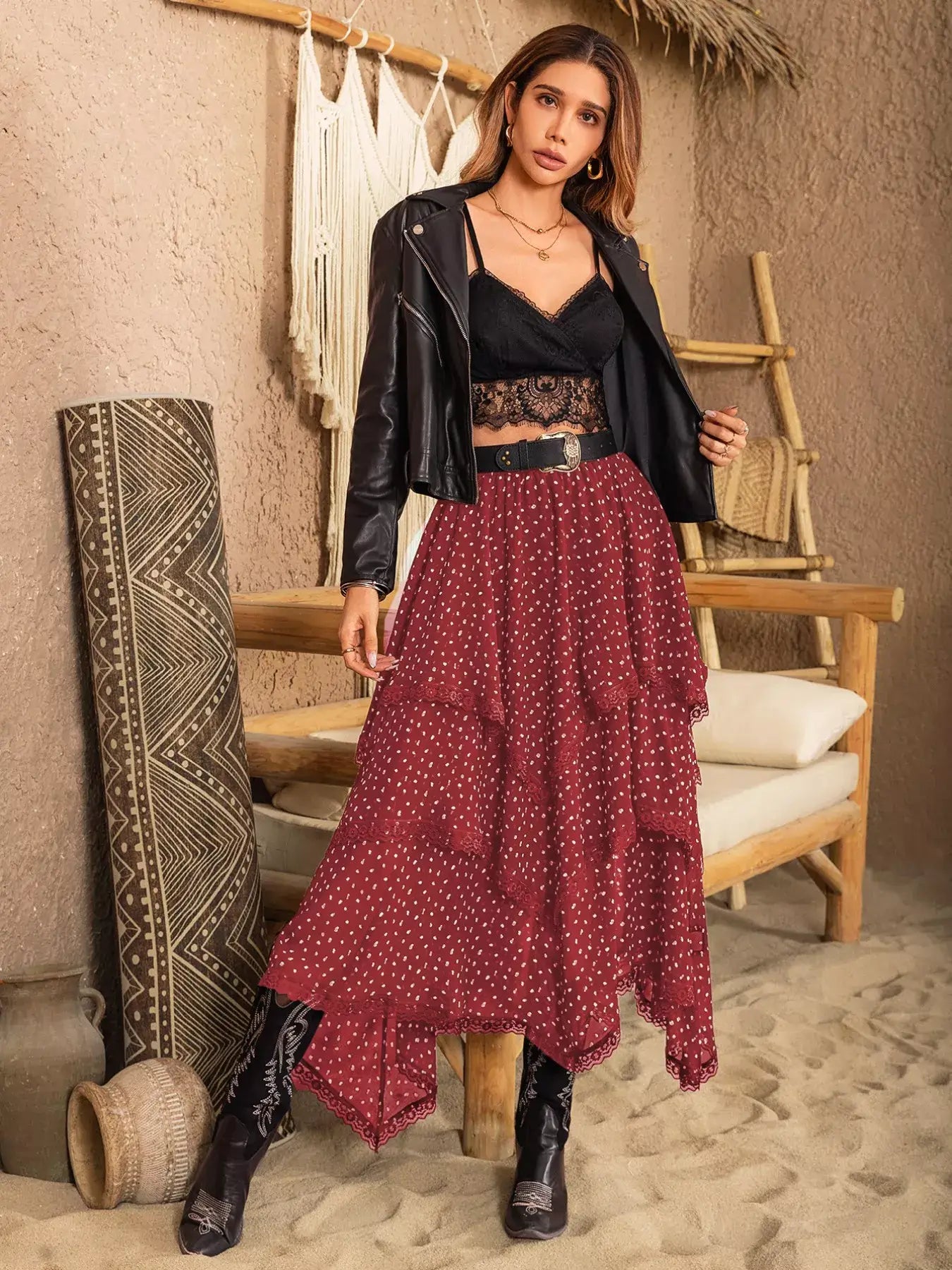 Lace Detail Layered Skirt styled with a black top and leather jacket, showcasing a flowing silhouette in a natural setting.