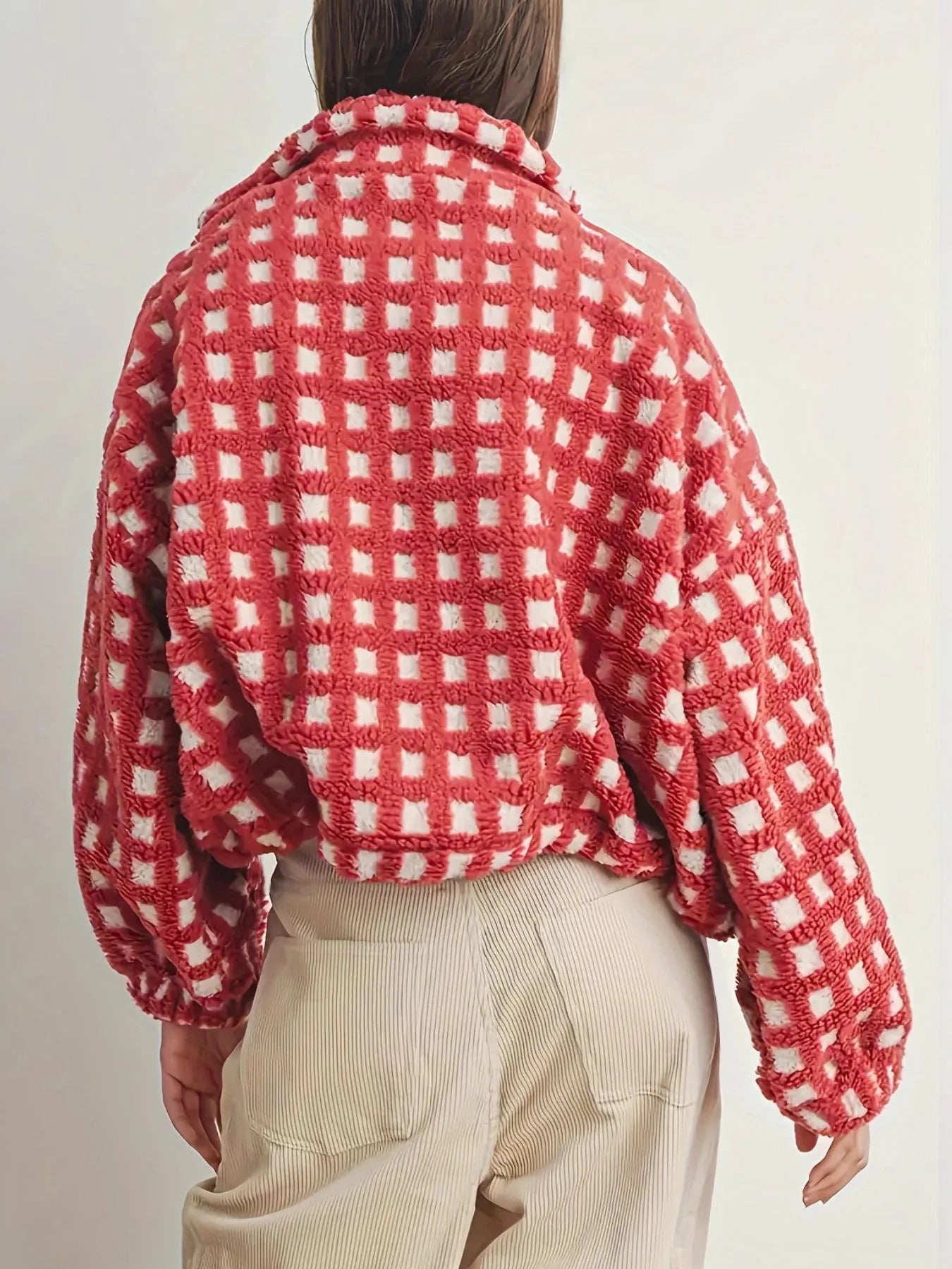 Back view of a woman wearing a Fleece Checkered Puff Sleeve Bomber Jacket with cozy oversized style.