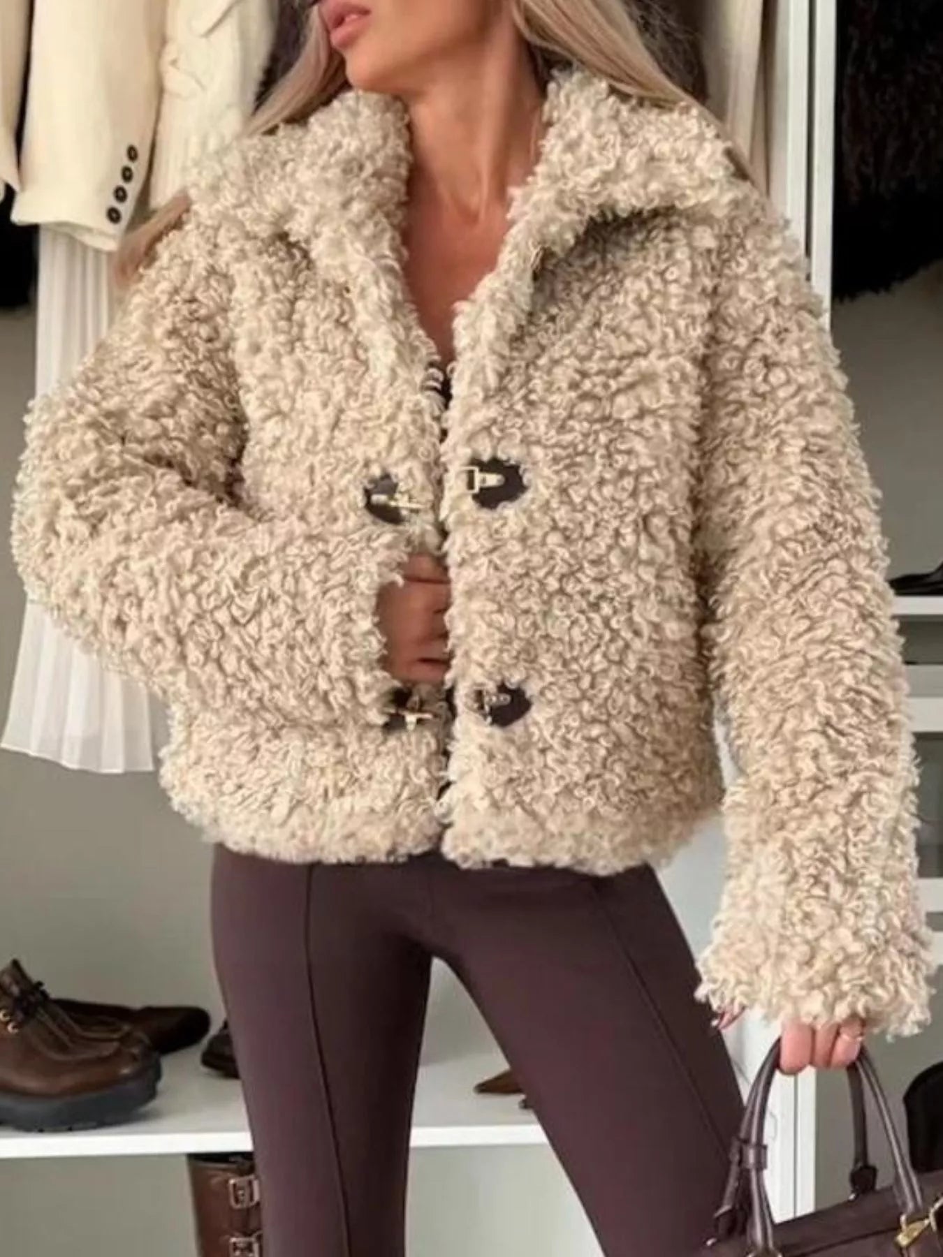 Model wearing Sherpa Button-Down Outerwear in beige with button details, perfect for cozy layering.