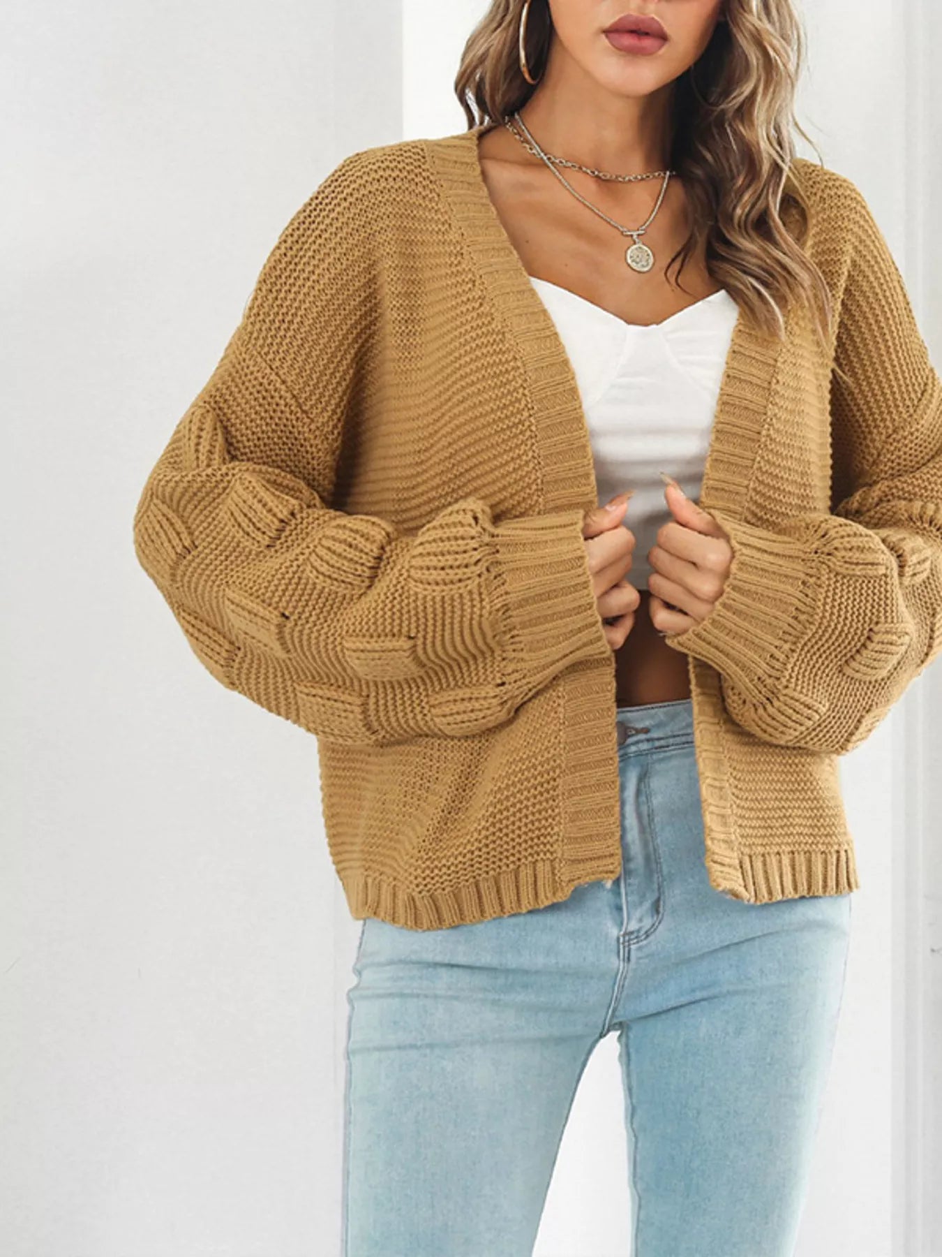 Chunky Knit Open Front Cardigan displayed in a cozy outfit, featuring ribbed details and slightly stretchy material.