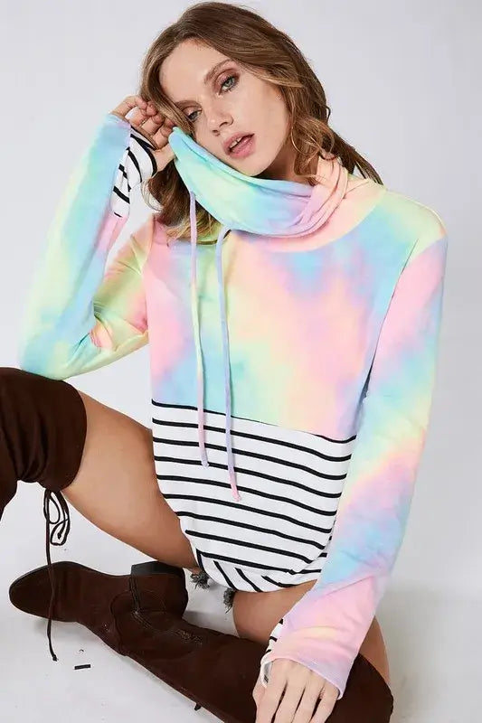 Model wearing the BiBi Tie Dye French Terry Cowl Neck Top with stripes in pastel colors for a casual look.