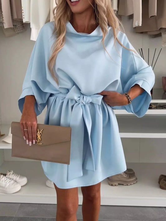 Model wearing Batwing Sleeve Tie Waist Mini Dress in light blue, featuring a belted waist and casual design.