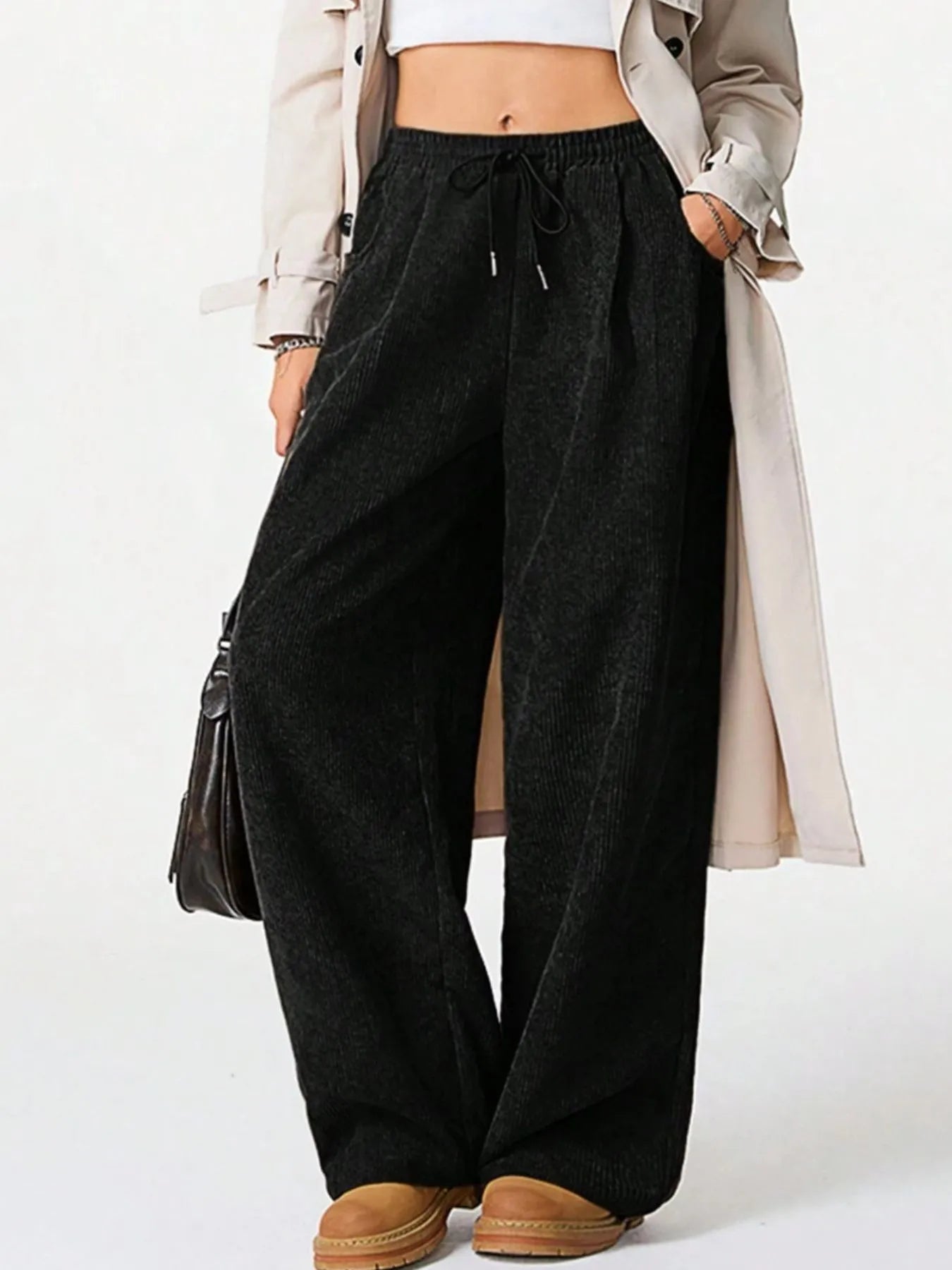 Woman wearing Drawstring Wide Leg Pants styled with a trench coat, showcasing comfort and relaxed fit.