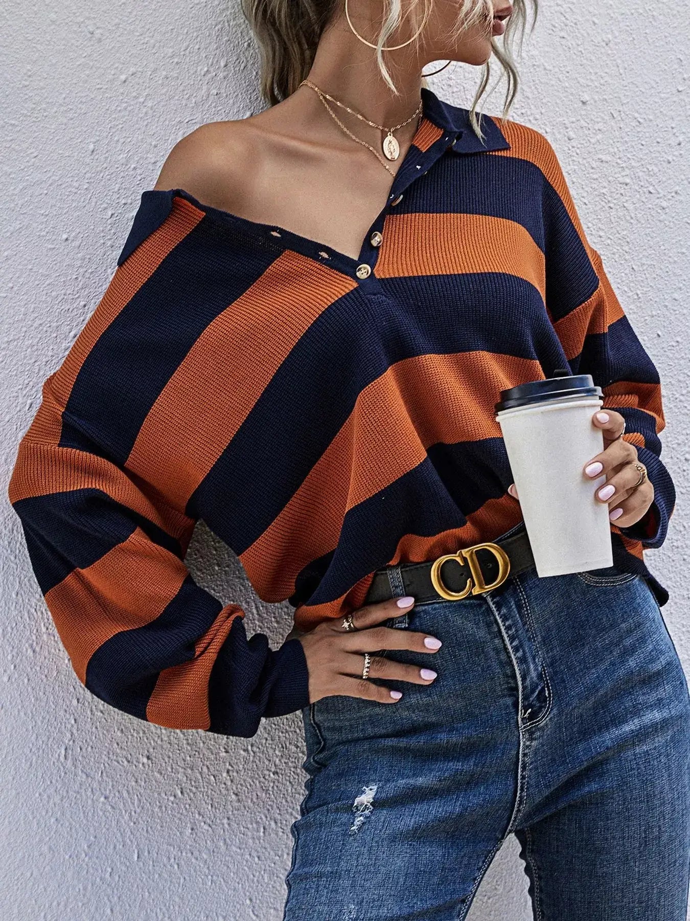 Striped Button Detail Dropped Shoulder Knit Top featuring bold stripes and button detailing with a relaxed silhouette.