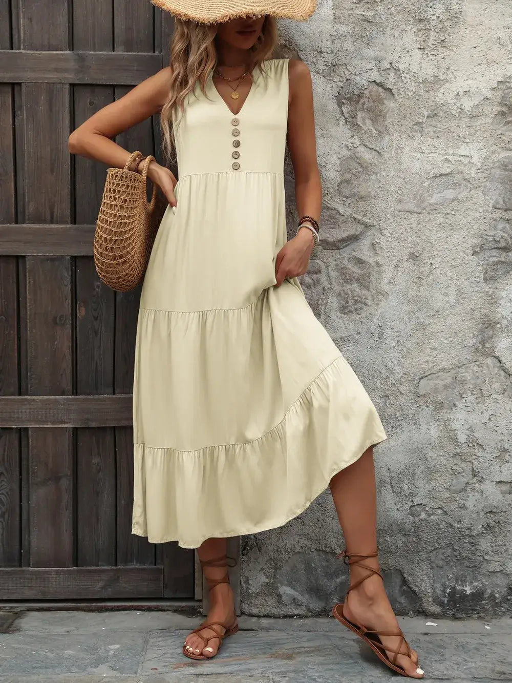 Model wearing Ivy Lane Decorative Button Notched Sleeveless Dress in light green with decorative buttons.