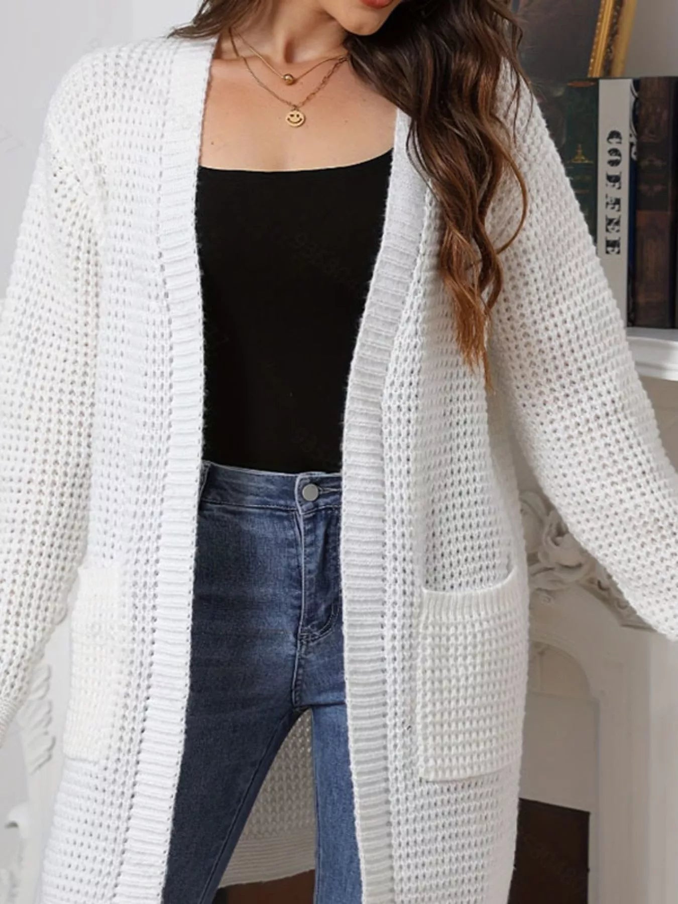 Chunky Knit Open Front Cardigan styled with black top and blue jeans, showcasing cozy layered fashion.