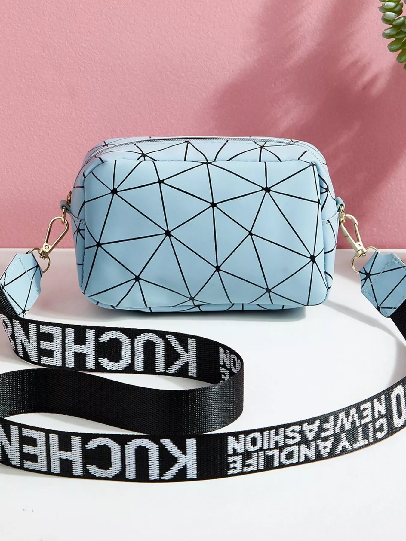 Geometric Pattern Crossbody Bag in light blue with black geometric design and adjustable strap for modern everyday style.