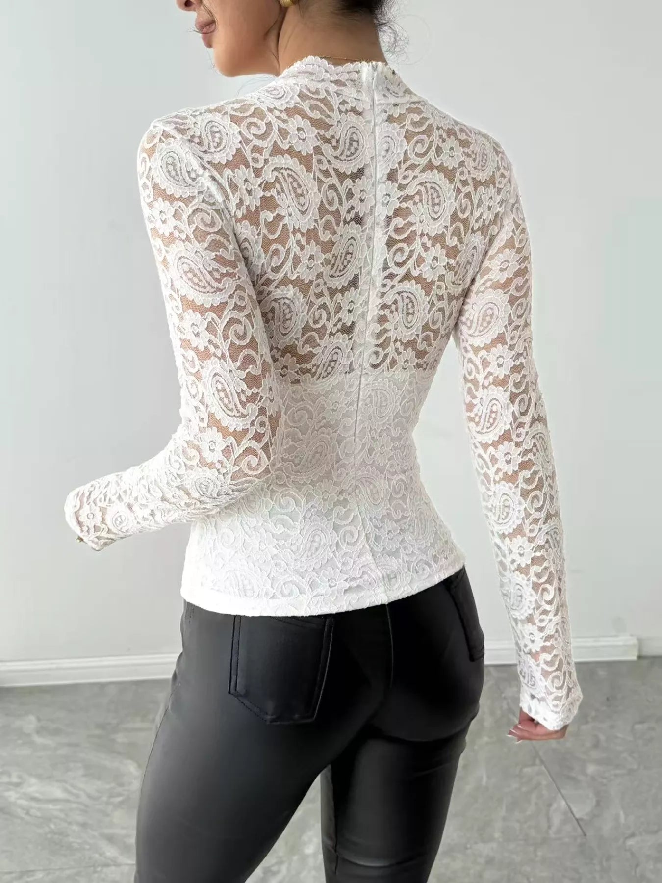 Lace Long Sleeve Top showing the back view, featuring sheer lace details and a form-fitted silhouette.