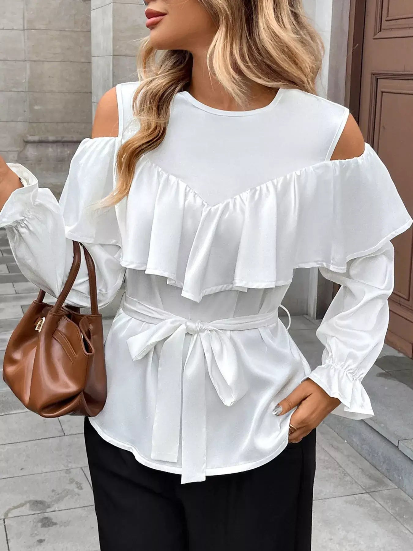 Ruffled Cold Shoulder Flounce Sleeve Blouse in white with ruffles and cold-shoulder design, styled with a brown bag.