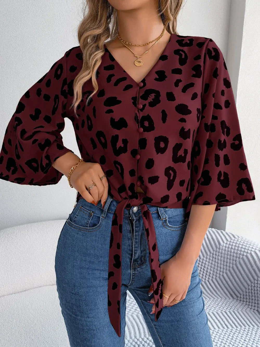 Tied Button Up Leopard V-Neck Blouse featuring a stylish tied design and leopard print, perfect for trendy outfits.