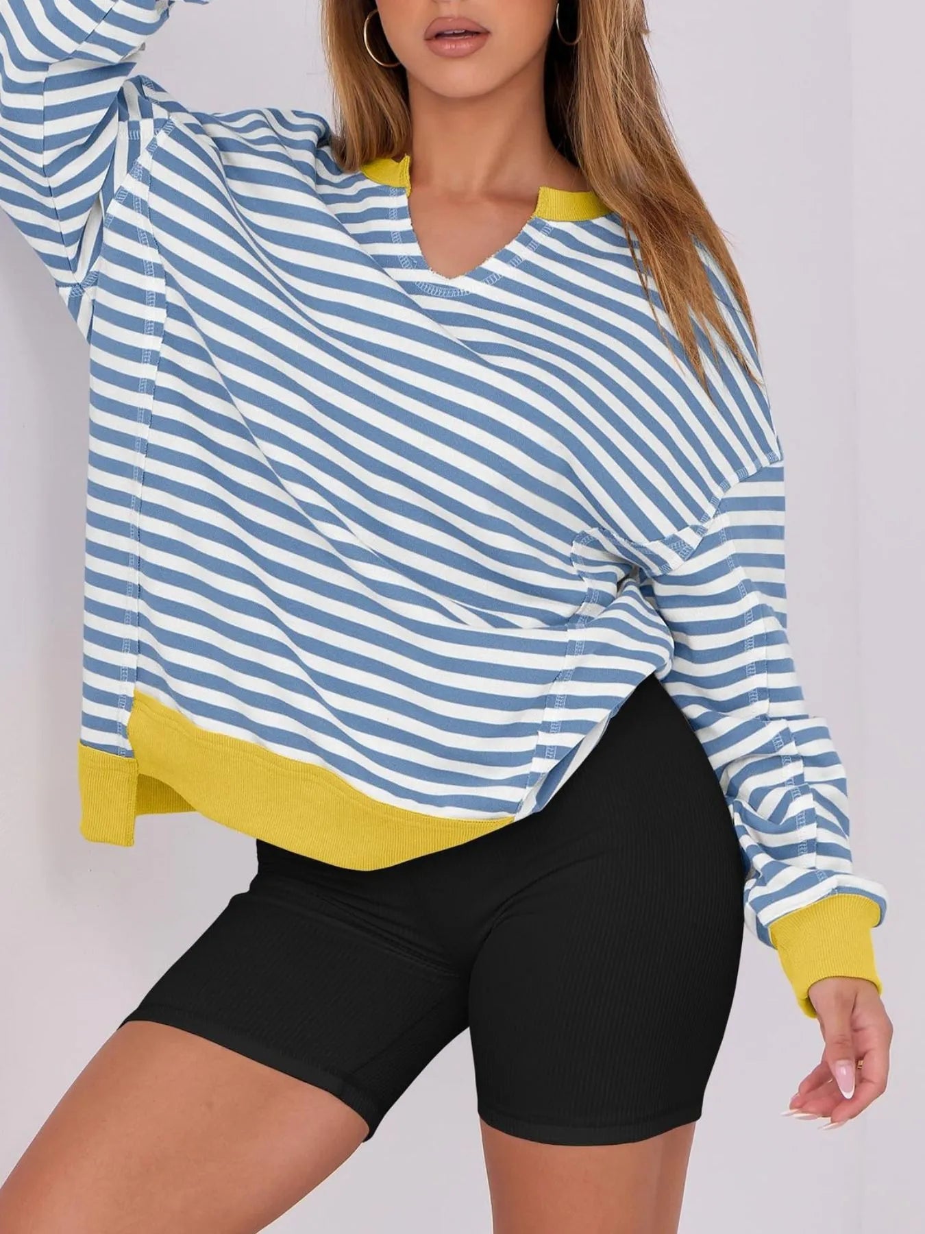 Notched Long Sleeve Oversized Sweatshirt with blue and white stripes and yellow accents for casual wear.