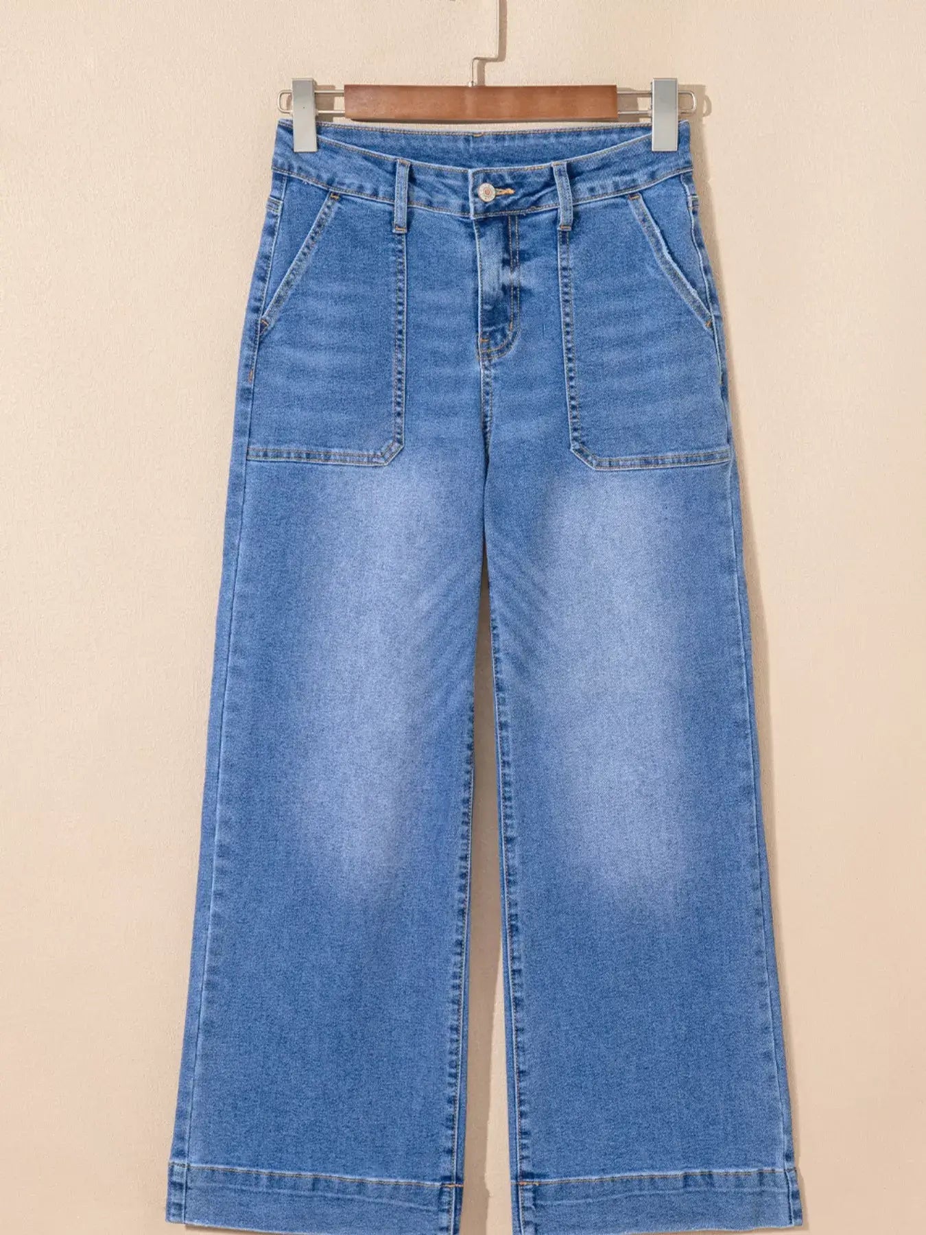 High-Waisted Wide Leg Flare Jeans in light blue denim, featuring a flattering high-rise and wide leg cut.