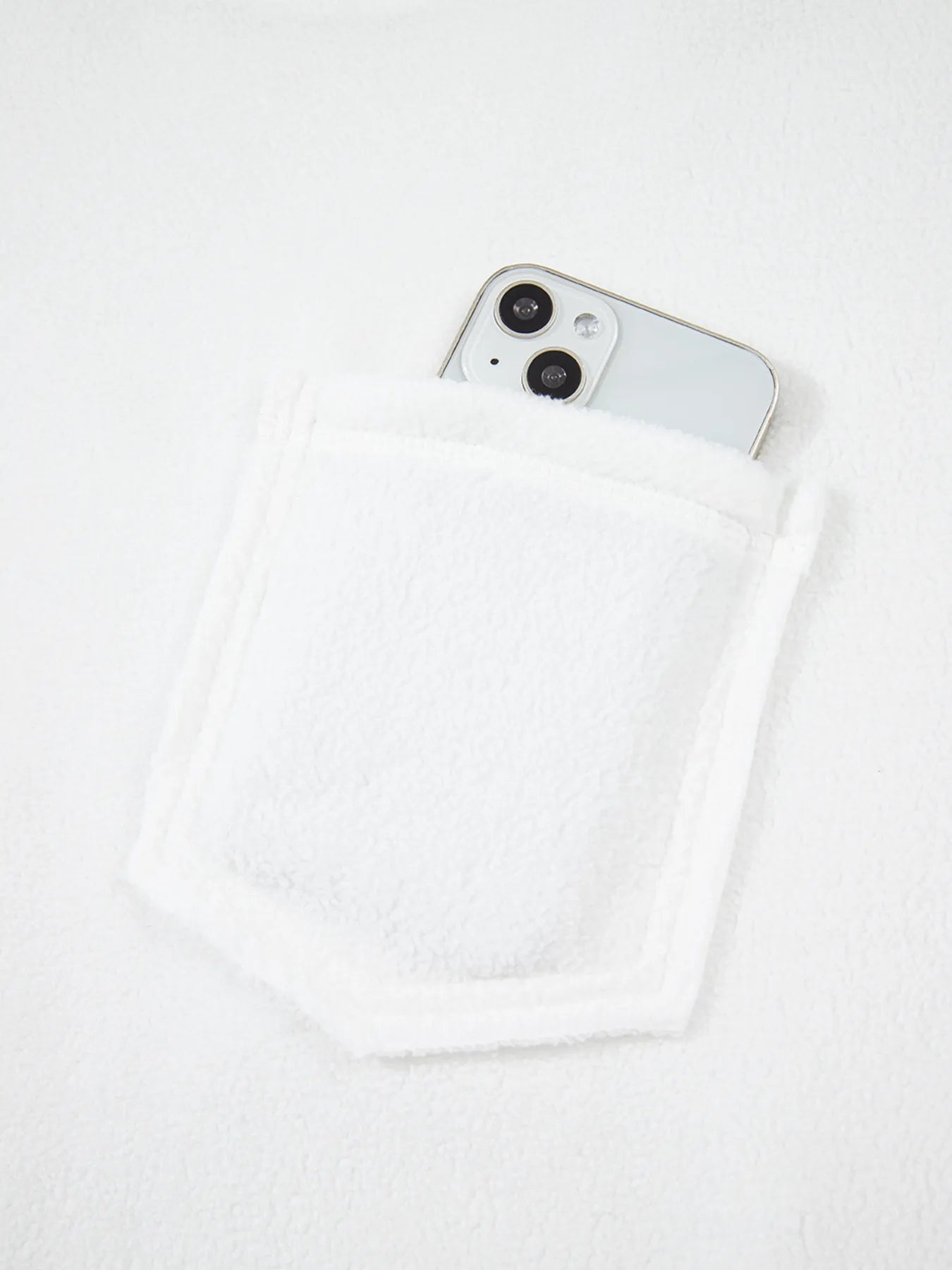 Exposed Seam Chest Pocket Knit Pullover Sweatshirt with a phone in a pocket, showcasing casual style and functionality.