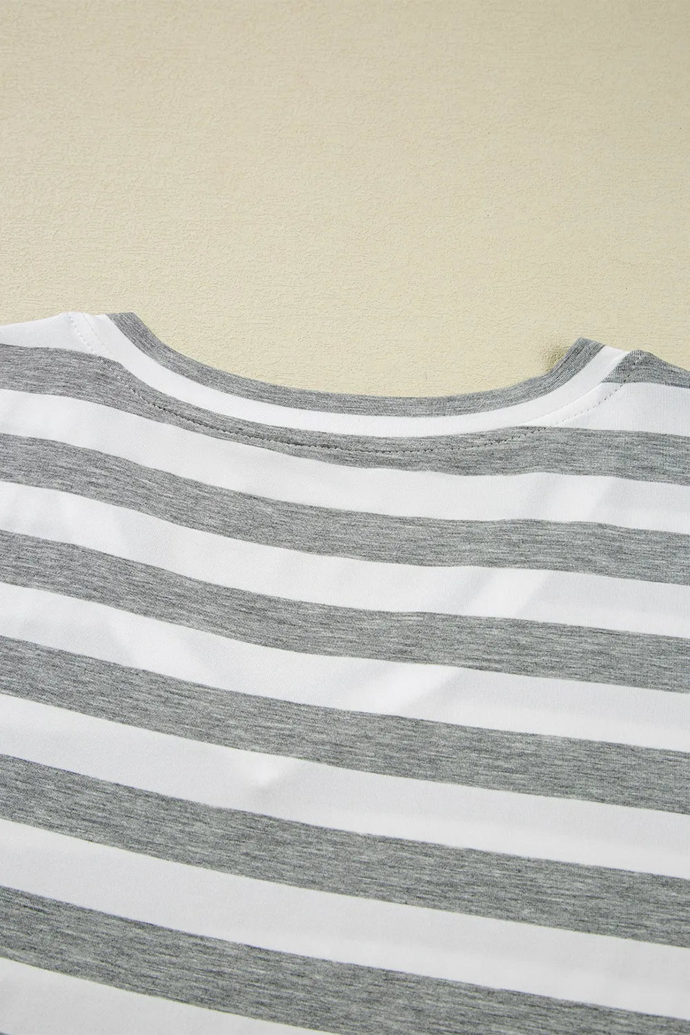 Casual Striped V-Neck Midi T-Shirt Dress showcasing gray and white stripes, perfect for everyday style.