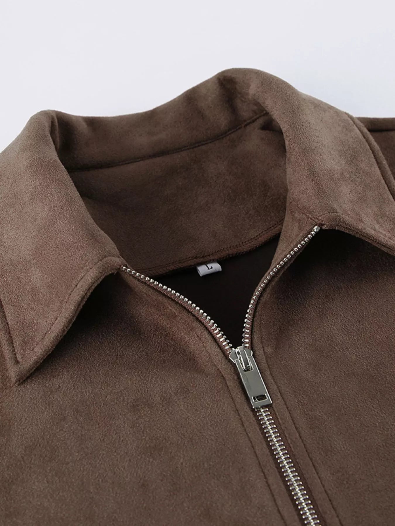 Close-up of the collar and zipper of the Zip-Up Dropped Shoulder Jacket in brown, showcasing its modern and relaxed style.