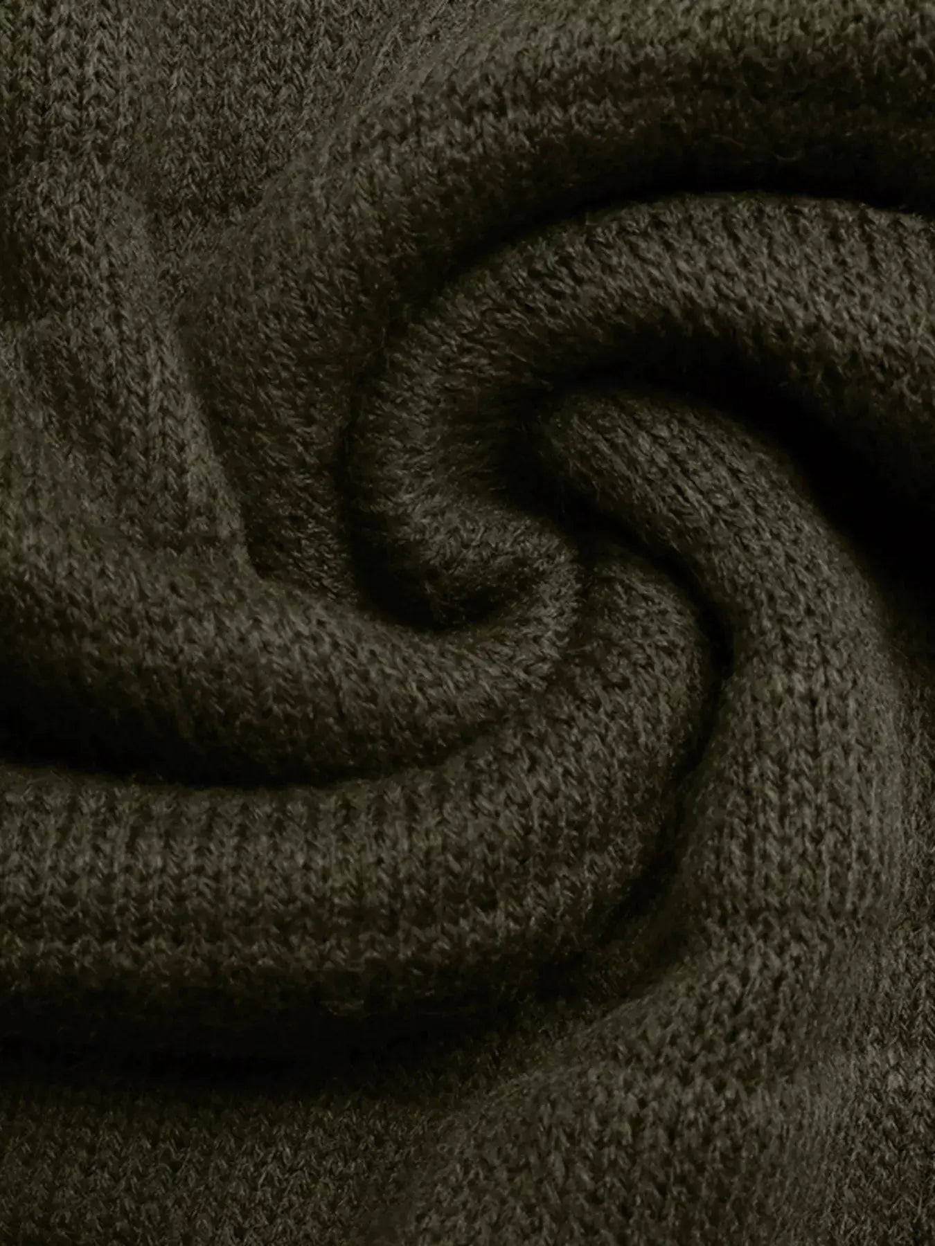 Close-up of the soft texture of the Boat Neck Ribbed Long Sleeve Sweater in dark green.