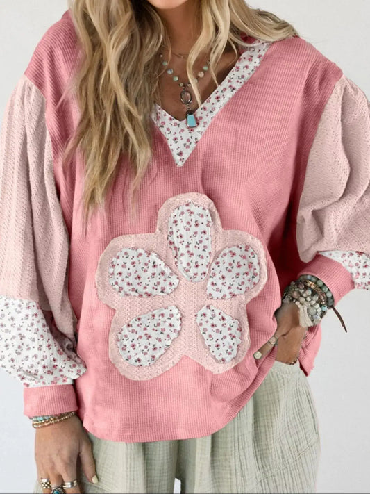 Floral Patch V-Neck Sweatshirt featuring a feminine floral patch design and oversized fit in pink tones.