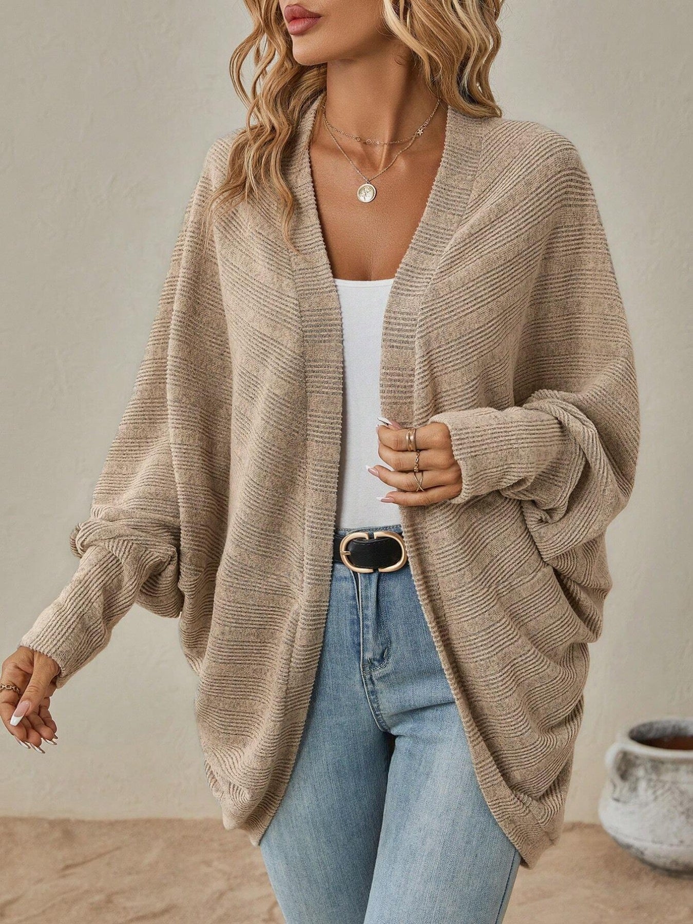 Model wearing an Open Front Batwing Sleeve Cardigan in beige, showcasing lightweight, slightly stretchy fabric.