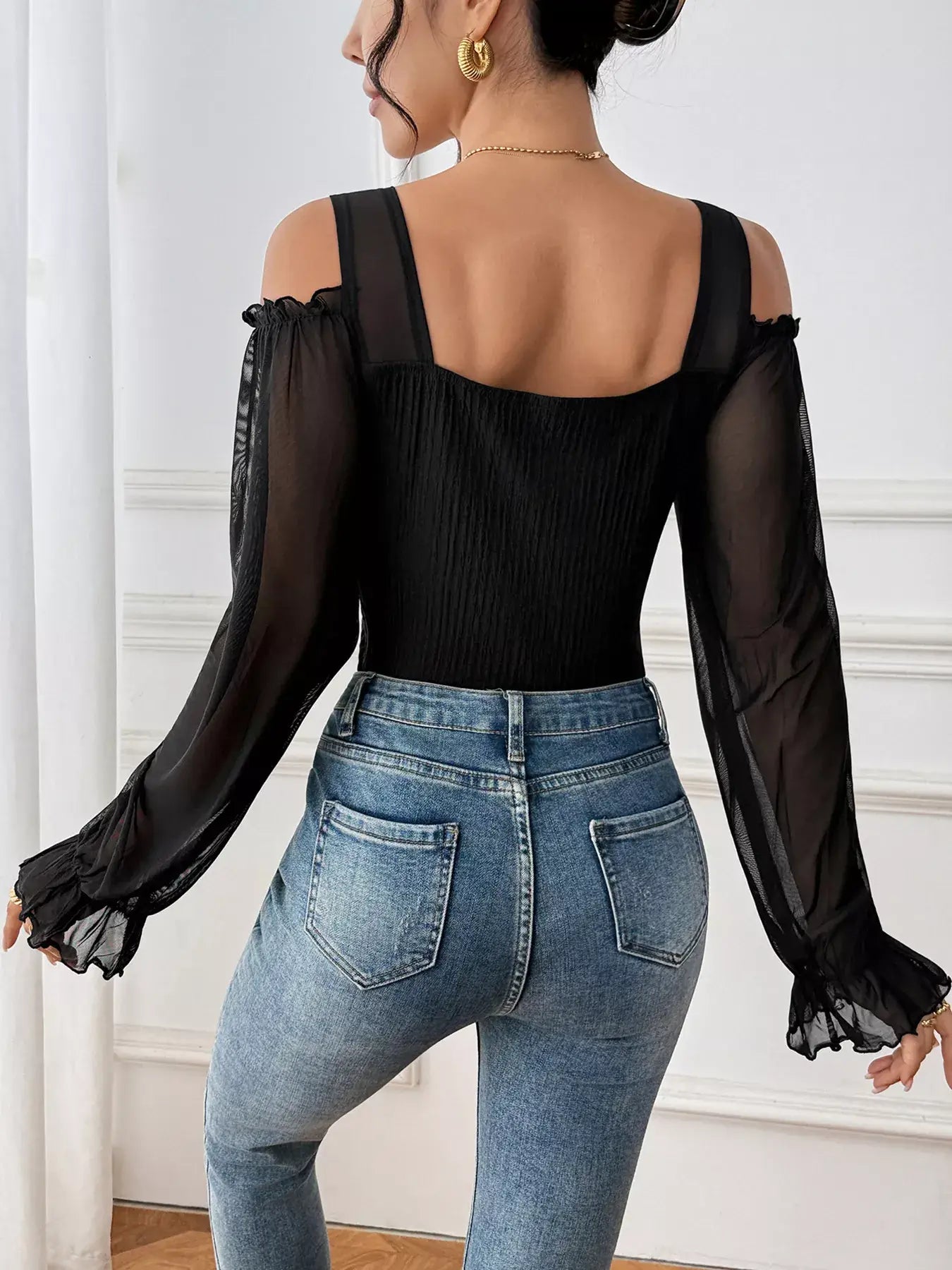 Cold Shoulder Flounce Sleeve Bodysuit in black, showcasing flounce sleeves and stylish cold-shoulder cutouts.