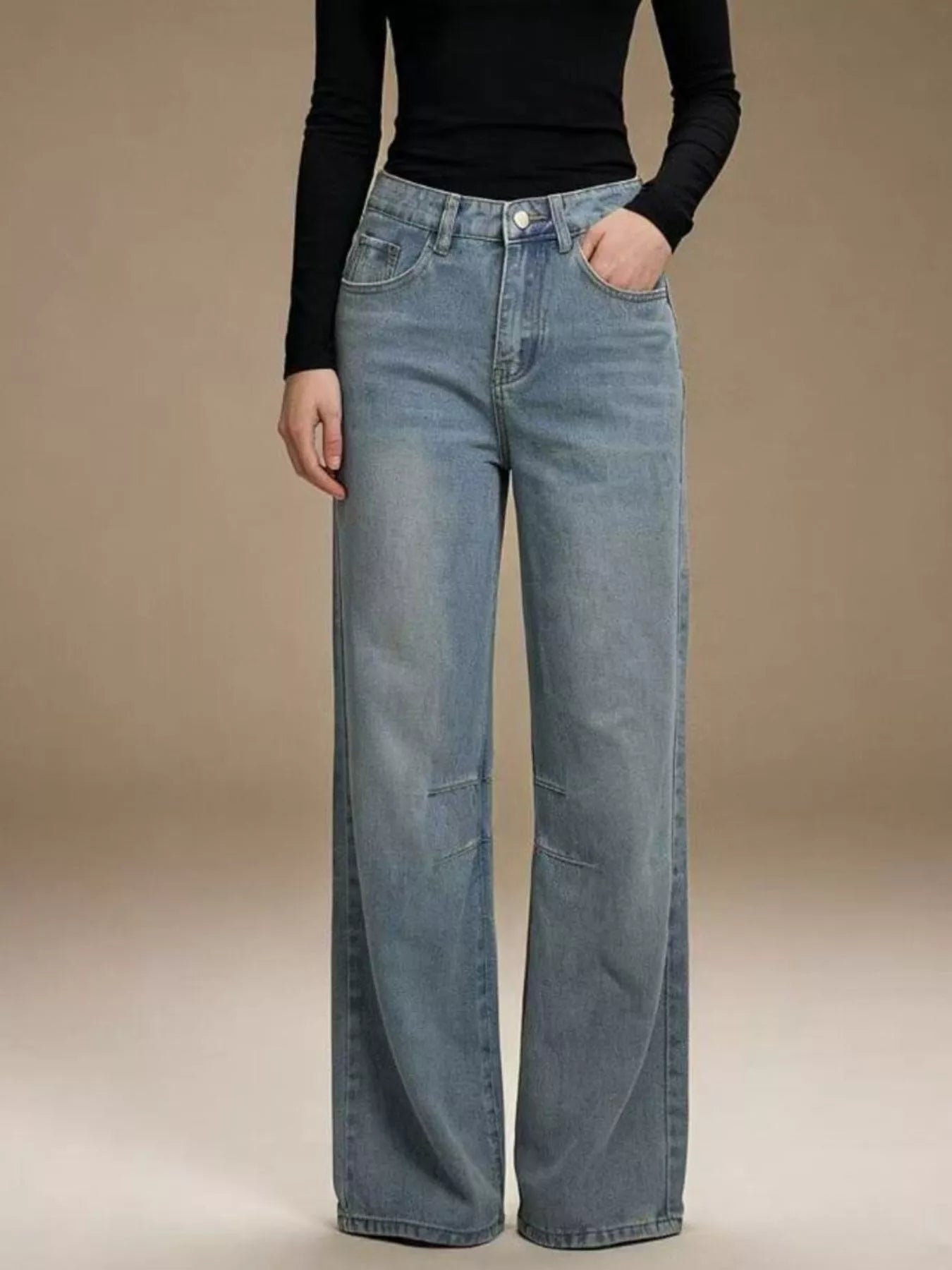 Wide Leg Wash Jeans with Buttoned Pocketed Design in light blue color worn by a model.