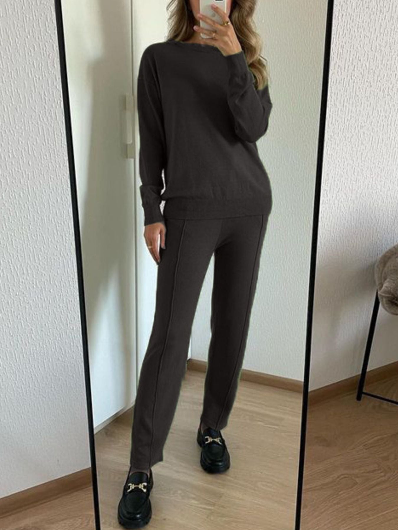 Model showcasing Long Sleeve Top and Pants Sweater Set in dark color, standing in front of a mirror.