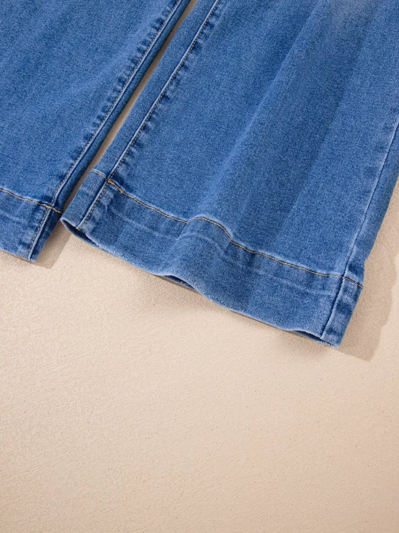 Close-up view of the hem of High-Waisted Wide Leg Flare Jeans showcasing its stylish wide leg cut.