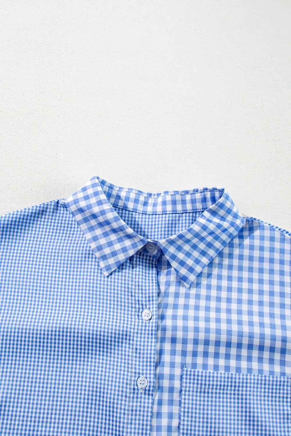 Plaid Button Up Long Sleeve Shirt in blue gingham pattern with pocket detail.