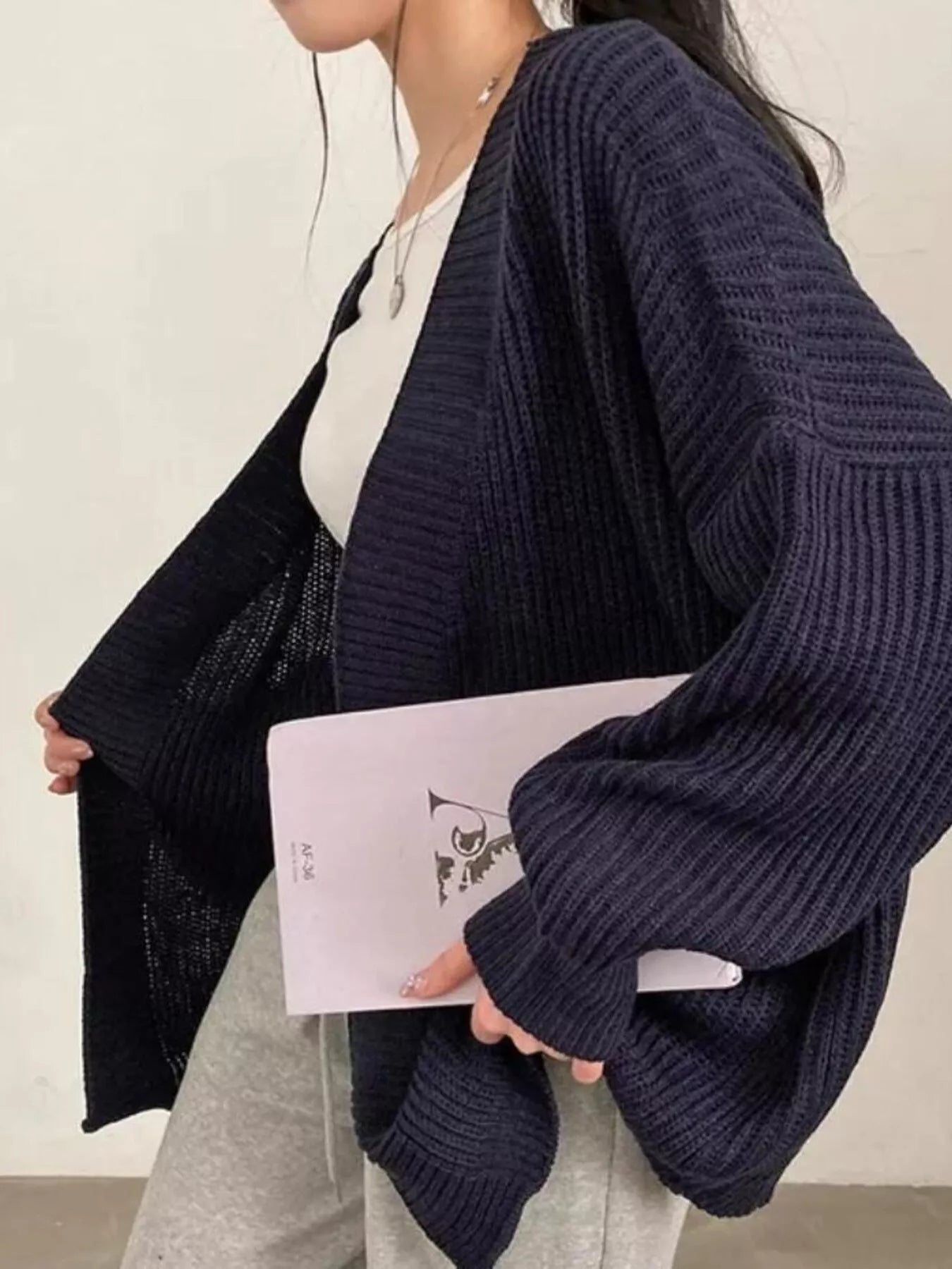Open Front Oversized Knit Cardigan for Women styled with casual outfit and a notebook in hand.